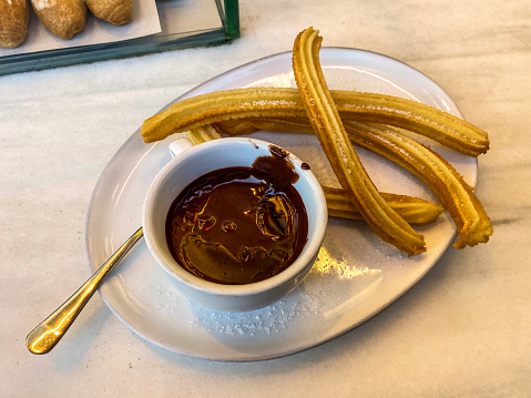 a pile of porras, thick churros typical of Spain