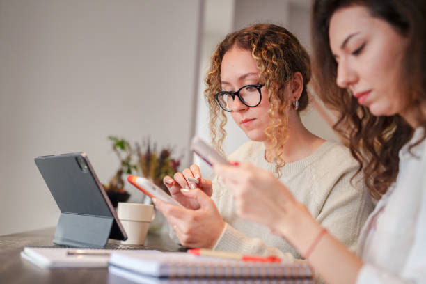 istock Two women working together at the office. 1934297173