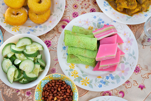 Close-up of popular traditional Malaysian assorted sweet food snacks on dining table on Eid-Ul-Fitr Celebrations.