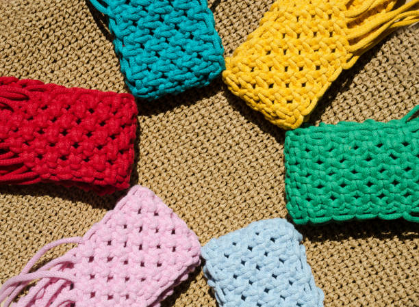 istock Small bags are knitted using the macrame technique from cotton cord. 1934324128