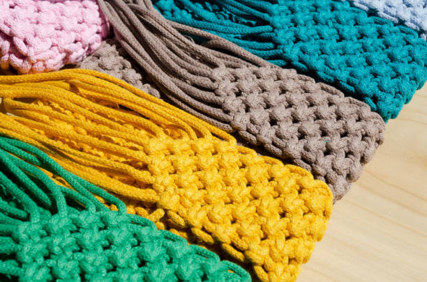 istock Small bags knitted using the macrame technique from cotton cord. 1934324642