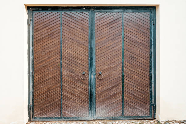 Old barn gate. Wooden rustic gate for a warehouse, stable or barn. High quality photo