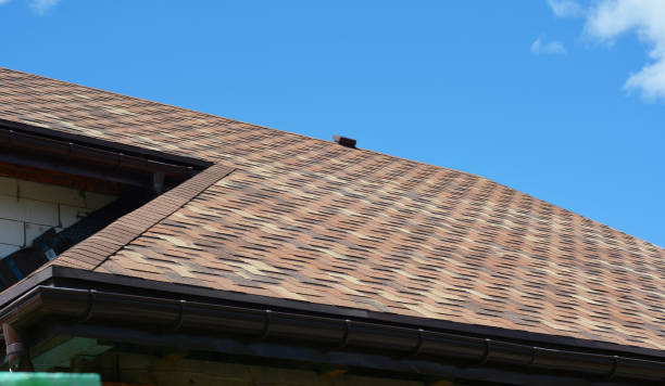istock Close up on asphalt shingles roofing construction. House asphalt shingles roofing construction waterproofing with vent on rooftop. 1934339966