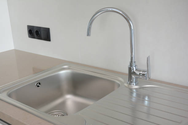Modern kitchen chrome faucet and ceramic kitchen sink.