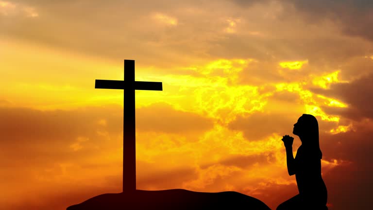 4k Time lapse : woman praying for forgiveness with Cross at sunset on a mountain