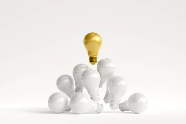 istock Distinctive gold light bulb floats above the white light bulb. concept of talented leadership and outstanding ideas 1934365249