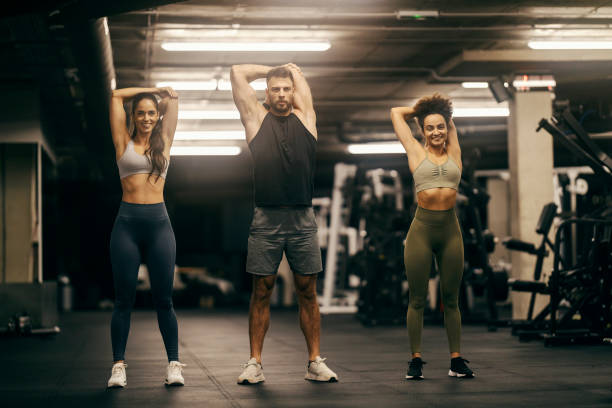 istock Group of friends exercising in a gym. 1934380208
