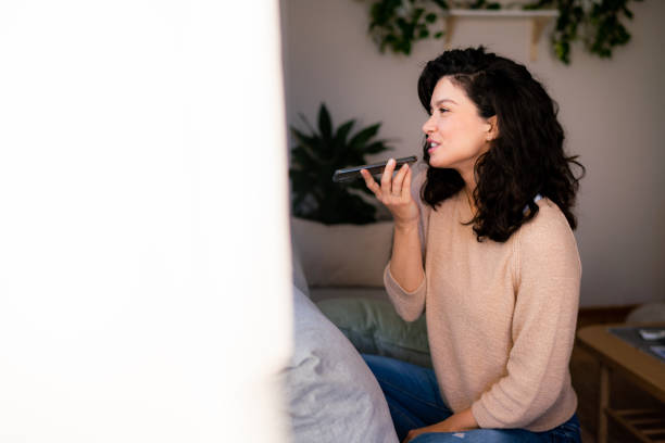 istock Woman talking on mobile phone at home 1934380718