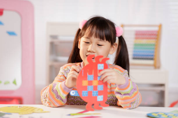 istock young girl making craft at home 1934389184