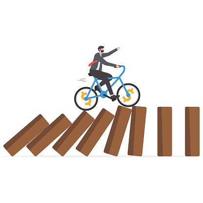 Business disruption, new disruptive innovation change, transform business and disrupt existing competitor company concept, smart innovative businessman surf fast bicycle hit all dominos collapse.