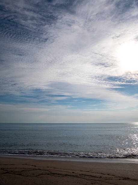istock View to a beach, sea and cloudy sky 1934402590