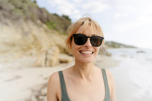 Portrait of a smiling woman at the seashore