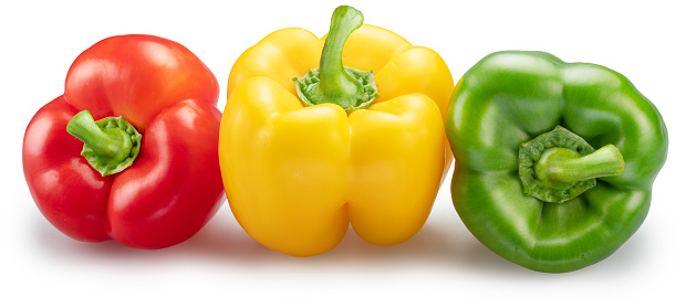 Green, yellow and red bell peppers isolated on white background. File contains clipping path.