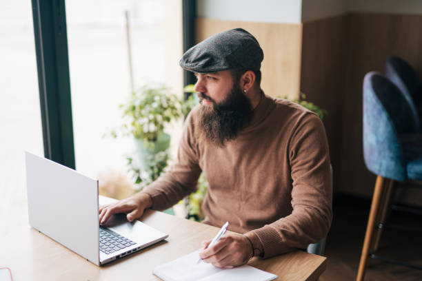 istock Shot of a young man using his laptop 1934442617
