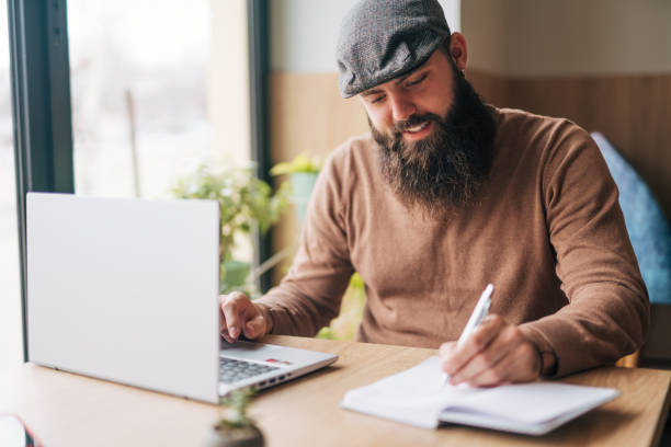 istock Shot of a young man using his laptop 1934443647