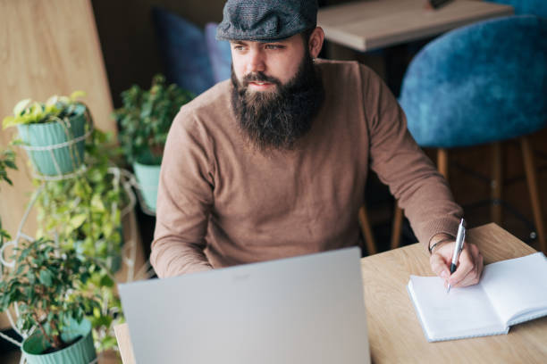 istock Shot of a young man using his laptop 1934443654