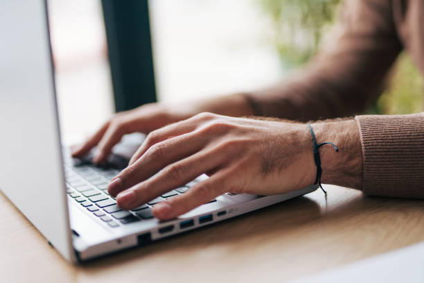 istock Close-up of man typing on keyboard of computer 1934445231