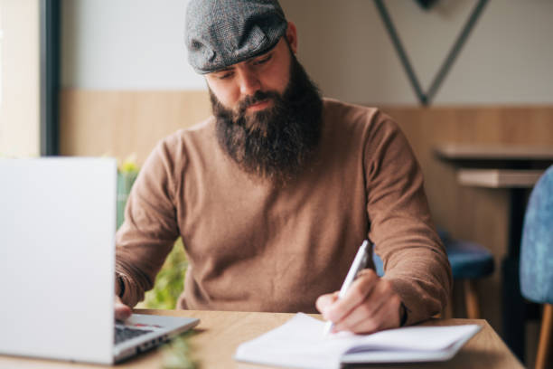istock Shot of a young man using his laptop 1934446797
