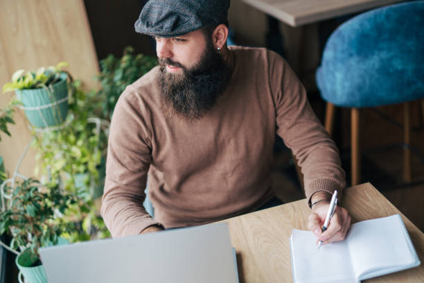 istock Shot of a young man using his laptop 1934447338