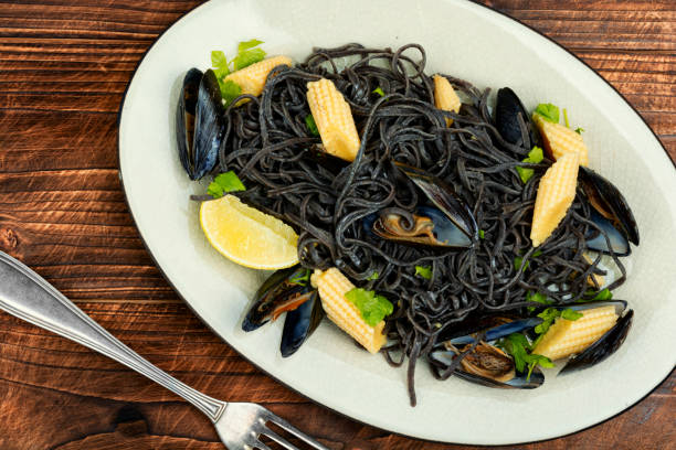 istock Black spaghetti pasta with mussels. 1934462664