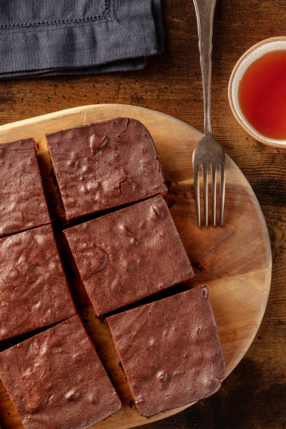 istock Chocolate brownie with tea, coffee cake, overhead flat lay view 1934471883