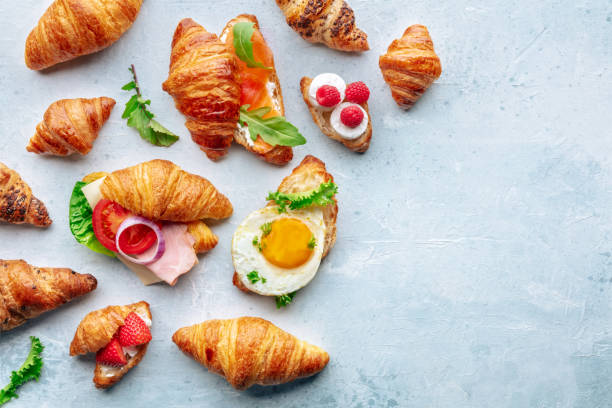 croissant sandwich assortment. various stuffed croissants, overhead - fried egg lettuce vegetable lunch photos et images de collection