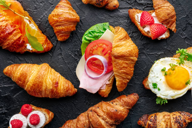 istock Croissant sandwich assortment. Many stuffed croissants, overhead flat lay 1934472904