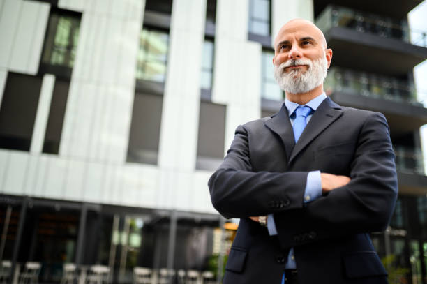 istock Mature businessman with a beard smiling confidently outside a mo 1934480987