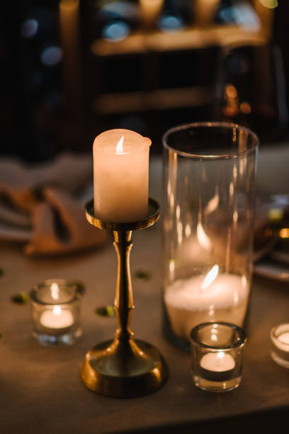 istock Burning candles for surprise marriage proposal. Luxury candlelight date in restaurant. Romantic dinner setup at night. Table set for couple, Valentine's Day evening. Decoration candle. Details closeup 1934494119