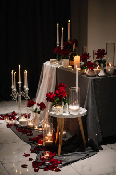 istock Burning candles for surprise marriage proposal. Luxury candlelight date in restaurant. Romantic dinner setup at night. Table set for couple, Valentine's Day evening. Decoration candle. Details closeup 1934494668