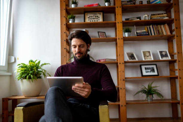 istock Low angle photo of man working from home 1934509558