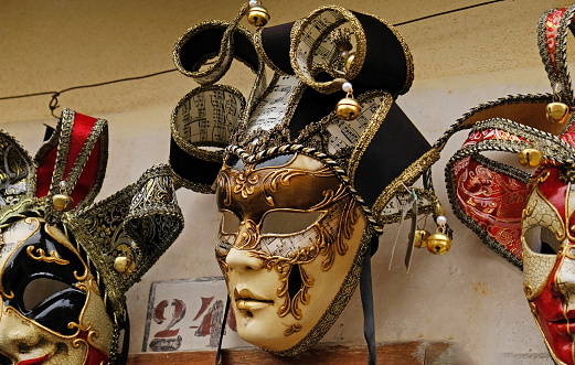 Venice, VE, Italy - February 13, 2024: Copuple with Venetian Mask at the Venice Carnival by the lagoon