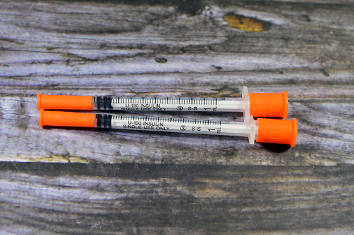 an insulin needle syringe, used to administer the Insulin dose to type 1 Diabetes mellitus ( insulin dependent) and some cases of type 2 (non insulin dependent), for subcutaneous route, selective focus