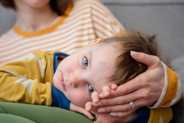 istock Loving mother comforting son with bruise on the forehead 1934534481