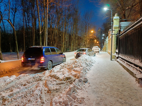 Stressed man and broken car on the snowy road