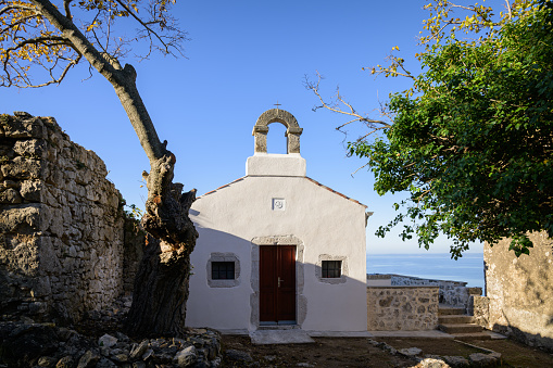 A small church near Pernat in Cres, sunny day in autumn, blue sky