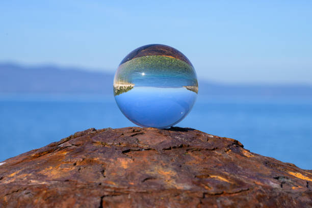 istock Glass ball lying on a rusty bollard 1934557022
