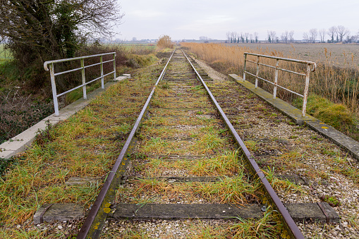 Abandoned railroad track near Arles (Provence, France) in winter