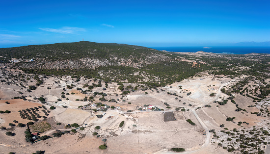Gavdos island, Crete, Greece. Aerial drone above view of wild rocky landscape, green low vegetation plant. All year holiday, adventure  destination.