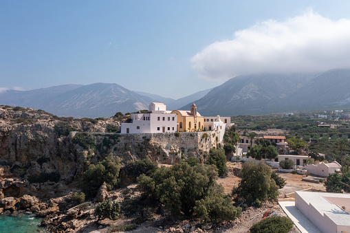 Chrysoskalitissa Monastery, Chania town Creete island, Greeece. Aerial drone view of Orthodox Church built up on rock. Religious destination.