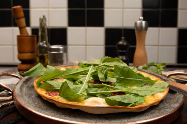 Brazilian pizza with sun-dried tomatoes, arugula and mozzarella. Traditional Brazilian Pizza