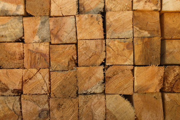 istock Stacked lumber texture showcasing natural wood grain. Perfect for background in architecture, construction, carpentry, or eco-friendly material themes. 1934603377