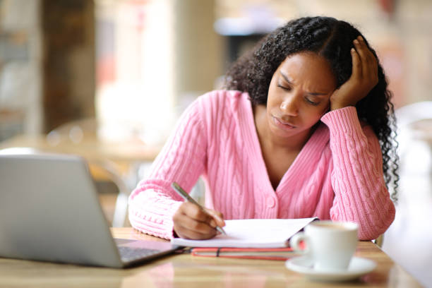 istock Worried student studying in a restaurant terrace 1934615372
