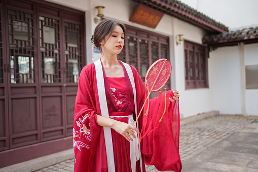 Chinese female tourist wearing red Hanfu