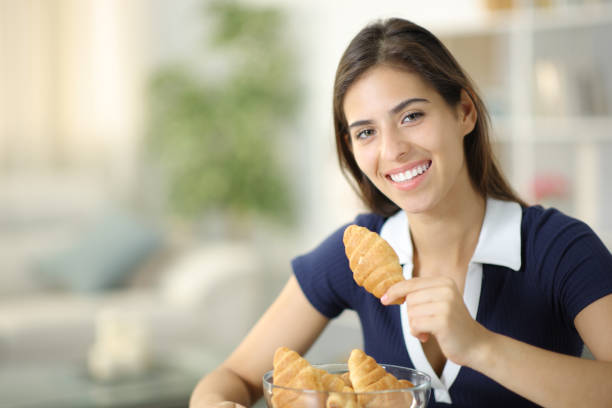 istock Happy woman posing holding bakery at home 1934619098