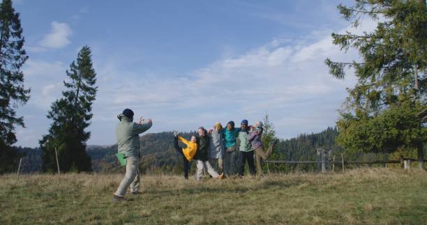 istock Diverse hikers take group picture during vacation trip in mountains 1934635916
