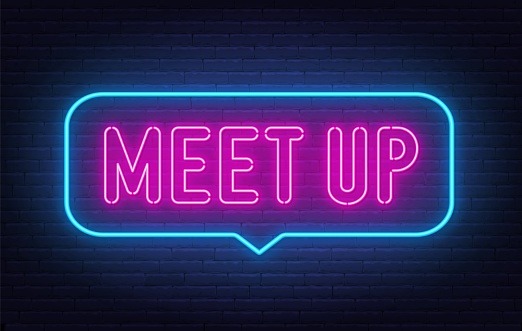 Meet Up neon sign in the speech bubble on brick wall background
