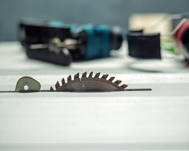 istock Saw table with saw blade, jig saw and hearing protector. 1934660762