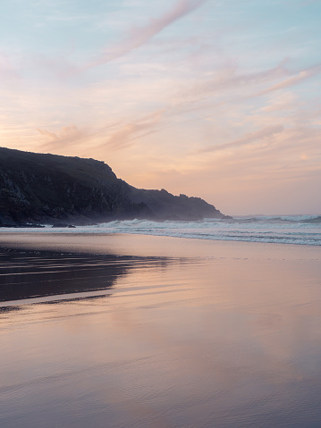 Sunset on the beach of Rostro. Finisterre Galicia, Spain. This beach is one of the stages of the lighthouse way that goes from Malpica to Finisterre along 200km in the Costa da Morte.