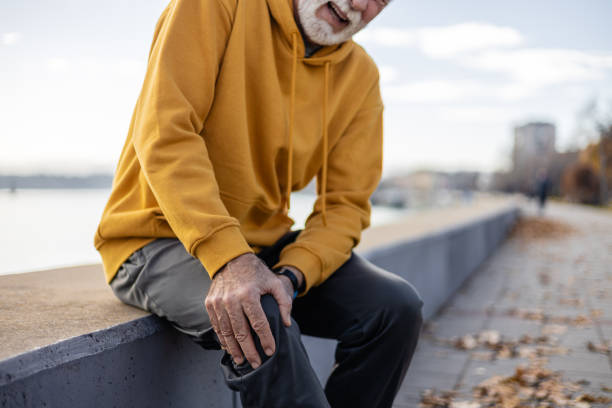 istock Close-up Active senior man experiencing knee pain while exercising outdoor 1934674257